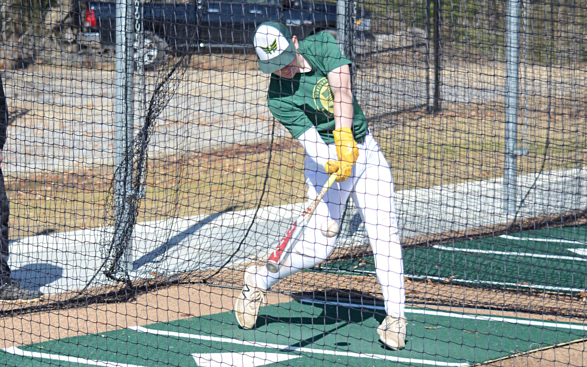 Alex Sinclair goes low to hit a ball from Brandon Parker Jr.