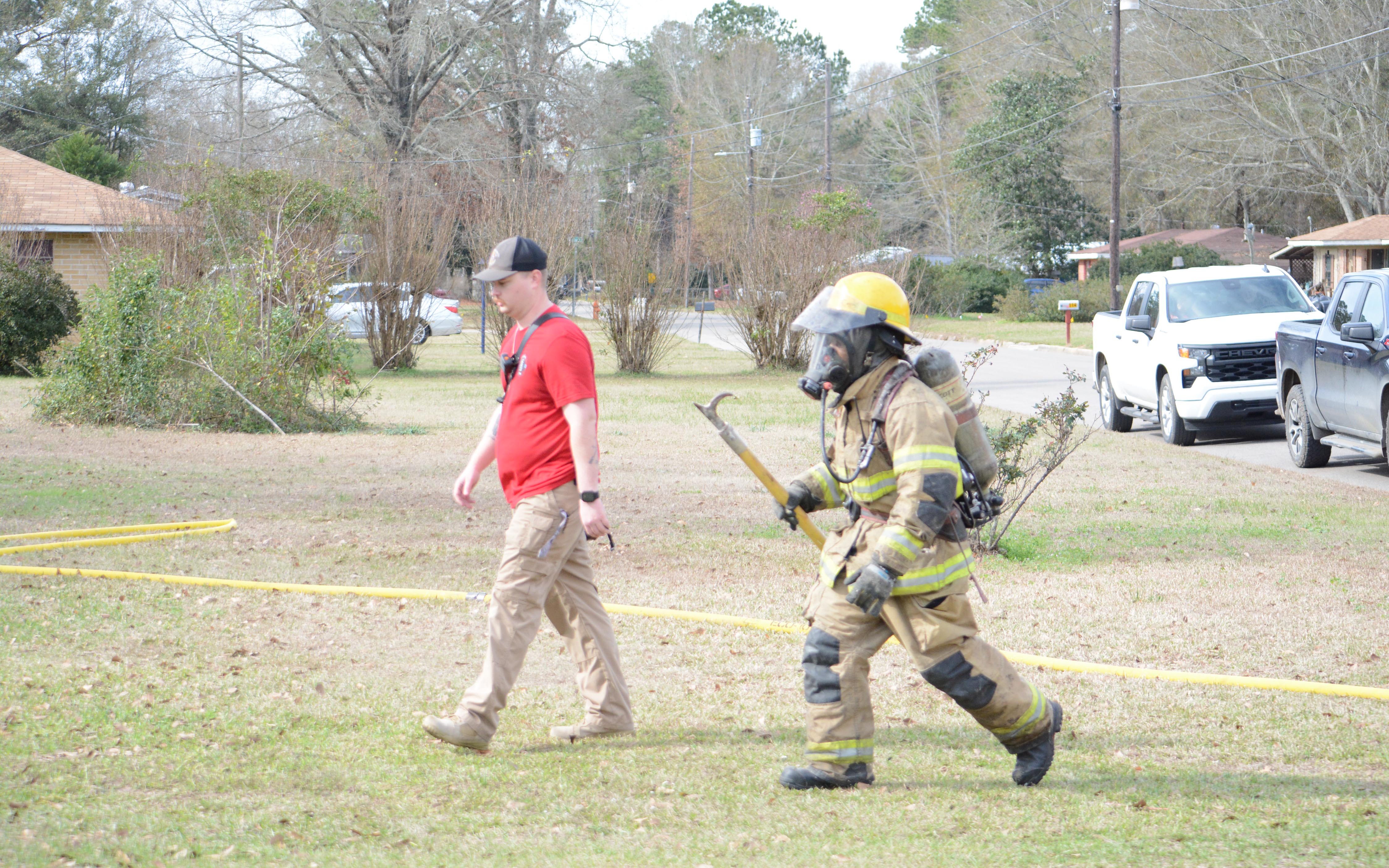 Firefighter approach the house