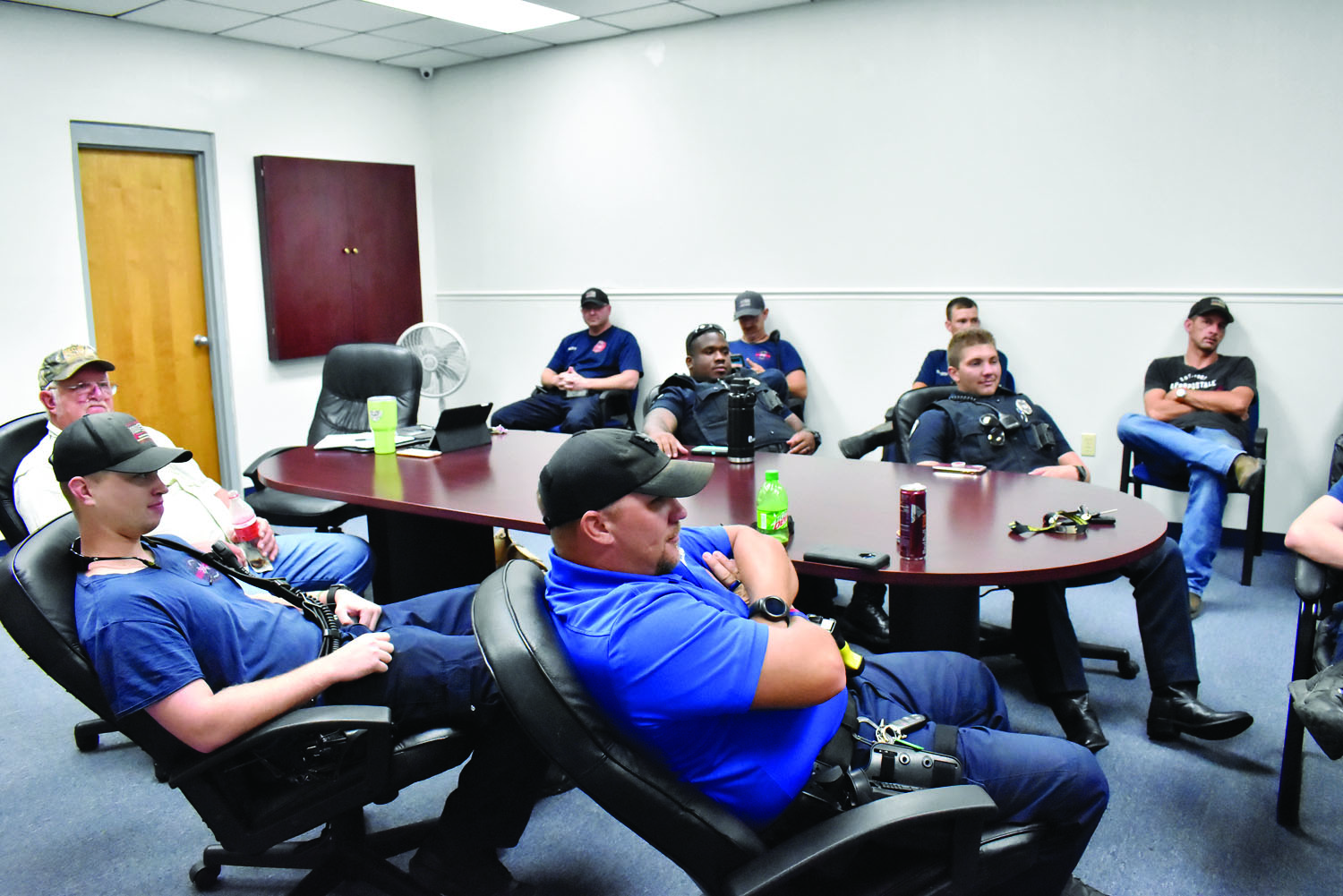 Members of the Columbia Police Department and Columbia Fire Department attend the National Weather Service briefing Sunday morning at the police department. 