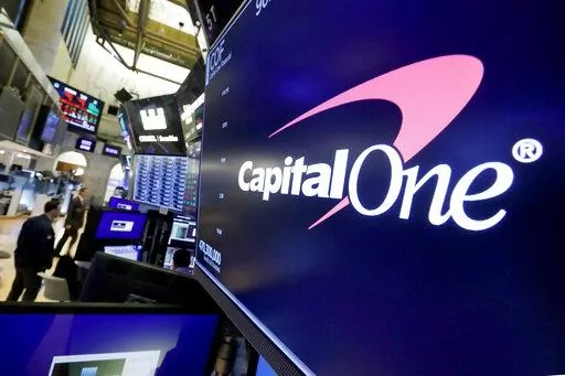 The logo for Capital One Financial is displayed above a trading post on the floor of the New York Stock Exchange, July 30, 2019. A federal jury on Friday, June 17, 2022, convicted a former Seattle tech worker of several charges related to a massive hack of Capital One bank and other companies in 2019. (AP Photo/Richard Drew, File)