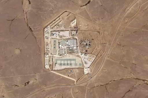 This satellite photo from Planet Labs PBC shows a military base known as Tower 22 in northeastern Jordan, on Oct. 12, 2023. Three American troops were killed and "many" were wounded Sunday, Jan. 28, 2024, in a drone strike in northeast Jordan near the Syrian border, President Joe Biden said. He blamed Iran-backed militia groups for the first U.S. fatalities after months of strikes against American forces across the Middle East amid the Israel-Hamas war. U.S. officials identified Tower 22 as the 
