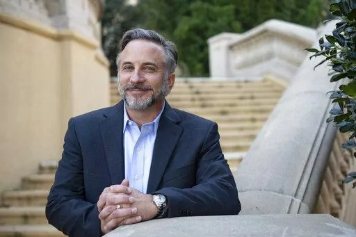 Brandon Dardeau, the new president and chief operating officer of southeast operations at Beau Rivage Resort & Casino, poses for a portrait outside the Beau Rivage in Biloxi, Miss, on Tuesday, Jan. 18, 2022. Dardeau was promoted to the position on Jan. 4 after holding various positions at the casino over the years. (Hannah Ruhoff/The Sun Herald via AP)