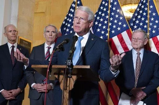 Sen. Roger Wicker, R-Miss., center, accompanied by Sen. Rick Scott, R-Fla., Sen. Rob Portman, R-Ohio, and Sen. Jim Inhofe, R-Okla. speaks during the Senate Armed Services and Senate Foreign Relations GOP news conference on Capitol Hill in Washington, Wednesday, Jan. 19, 2022. ( AP Photo/Jose Luis Magana)