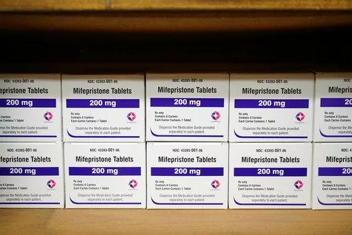Boxes of the drug mifepristone line a shelf at the West Alabama Women's Center in Tuscaloosa, Ala., on Wednesday, March 16, 2022. The drug is one of two used together in "medication abortions."   On Friday, June 17,  The Associated Press reported on stories circulating online incorrectly claiming medication abortions are dangerous.  (AP Photo/Allen G. Breed, File)
