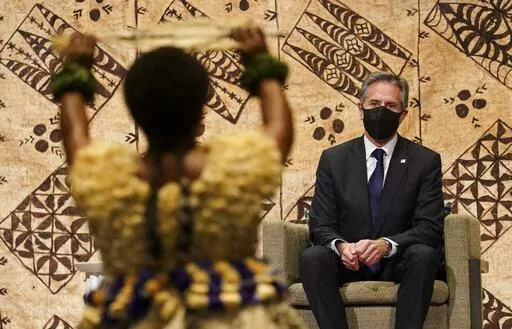 U.S. Secretary of State Antony Blinken watches a cultural farewell ceremony in Nadi, Fiji, Saturday, Feb. 12, 2022. (Kevin Lamarque/Pool Photo via AP)