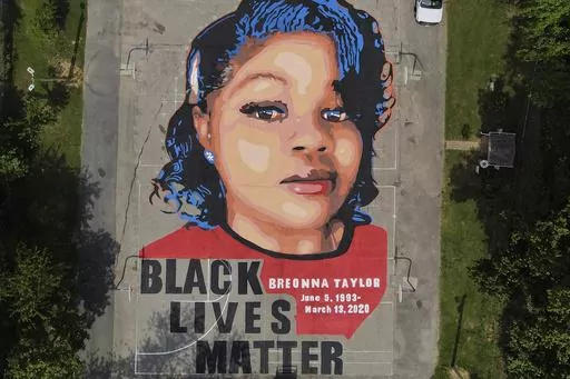 A ground mural depicting a portrait of Breonna Taylor is seen at Chambers Park in Annapolis, Md., July 6, 2020. The U.S. Justice Department has found Louisville police have engaged in a pattern of violating constitutional rights following an investigation prompted by the fatal police shooting of Taylor. The announcement was made Wednesday, March 8, 2023, by Attorney Merrick Garland. (AP Photo/Julio Cortez, File)