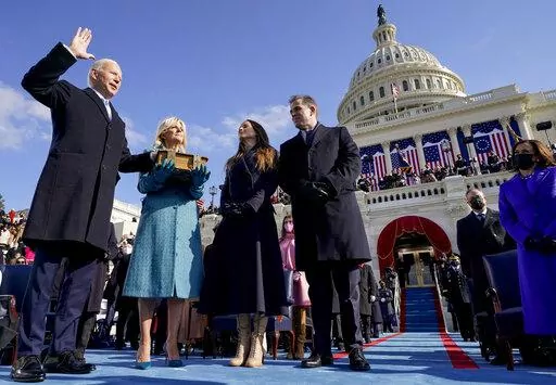 Joe Biden is sworn in as the 46th president of the United States by Chief Justice John Roberts as Jill Biden holds the Bible during the 59th Presidential Inauguration at the U.S. Capitol in Washington, on Jan. 20, 2021, as their children Ashley and Hunter watch.(AP Photo/Andrew Harnik, Pool, File)