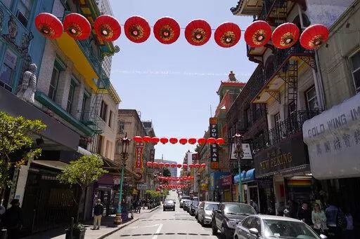 Lanterns hang in Chinatown above Grant Avenue in San Francisco, Monday, May 23, 2022. Chinatowns and other Asian American enclaves across the U.S. are using art and culture to show they are safe and vibrant hubs nearly three years after the start of the pandemic. From an inaugural arts festival in San Francisco to night markets in New York City, the rise in anti-Asian hate crimes has re-energized these communities and drawn allies and younger generations of Asian and Pacific Islander Americans. 
