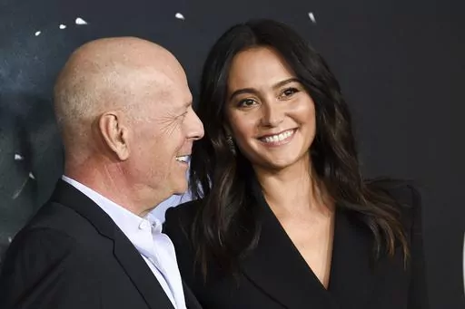 Actor Bruce Willis, left, and his wife Emma Heming Willis attend the premiere of "Glass" in New York on Jan. 15, 2019. Heming Willis is working on a guide to care giving that draws upon her experiences tending to her husband who has been diagnosed with frontotemporal dementia. The book, currently untitled, is scheduled for 2025. (Photo by Evan Agostini/Invision/AP, File)