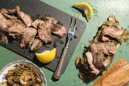 This image released by Milk Street shows a recipe for bocadillos with flank steak and mushrooms. (Milk Street via AP)