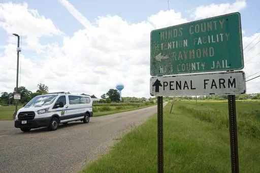 A Hinds County Sheriff's Department van passes the entrance to Hinds County Detention Facility, Aug. 1, 2022, in Raymond, Miss. Sheriff Tyree Jones said Monday, Oct. 16, 2023, that 200 inmates were removed from a part of the jail that has had security problems, and they were transferred to a privately run prison about two hours away. (AP Photo/Rogelio V. Solis, File)