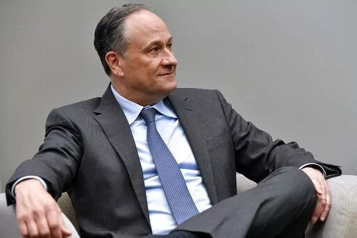 Second gentleman Doug Emhoff listens as he meet with women entrepreneurs for a panel discussion while visiting Mi Casa Resource Center in Denver, on March 11, 2022. The White House says Emhoff has tested positive for COVID-19. Vice President Kamala Harris tested negative, but is curtailing her schedule as a result of her husband’s positive test. (Jason Connolly/Pool via AP)