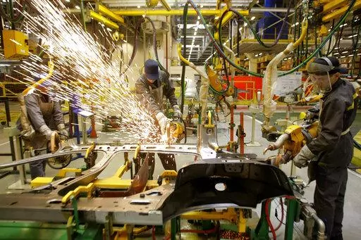 Workers of Renault's Moscow plant prepare car parts for the production line, on March 1, 2010. French automaker Renault moved to pause production at its Moscow plant in an apparent move to fend off mounting criticism, breaking ranks with other major French companies that have defied pressure to keep operating in Russia. The company's board of directors voted Wednesday night to suspend “activities at the Renault Moscow plant." It came hours after Ukrainian President Volodymyr Zelenskyy accused 