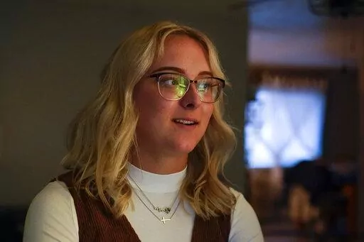 Pfc. Amiah Manlove, who is stationed with the U.S. Army in Oahu, Hawaii, talks about her travels, Thursday, Dec. 29, 2022, in New Whiteland, Ind. Active duty military personnel were caught in limbo as thousands of Southwest travelers stranded across the U.S. after waves of canceled flights. (AP Photo/Darron Cummings)