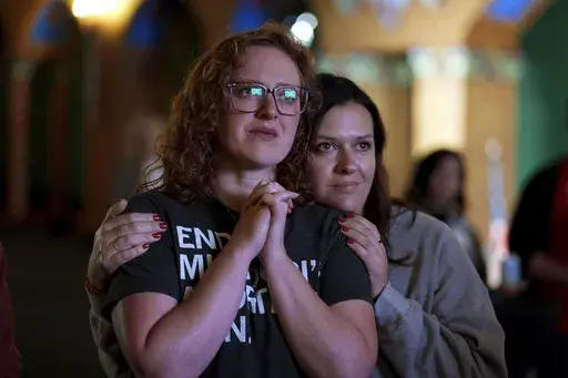 People giving their first names Erika, left, and Leeann react after an abortion rights amendment to the Missouri constitution passed, Tuesday, Nov. 5, 2024, at a watch party in Kansas City, Mo. (AP Photo/Charlie Riedel, File)
