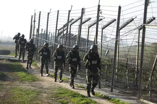FILE- Indian Border Security Force (BSF) soldiers patrol near the India-Pakistan border fencing at Suchet Garh in Ranbir Singh Pura, Jammu and Kashmir, India, Jan. 23, 2020. For decades, India has tried to thwart Pakistan in a protracted dispute over Kashmir. But in the last two years, policy makers in New Delhi have been increasingly turning their focus to Beijing, in a significant shift in India's foreign policy as the nation celebrates 75 years of independence. (AP Photo/Channi Anand, File)