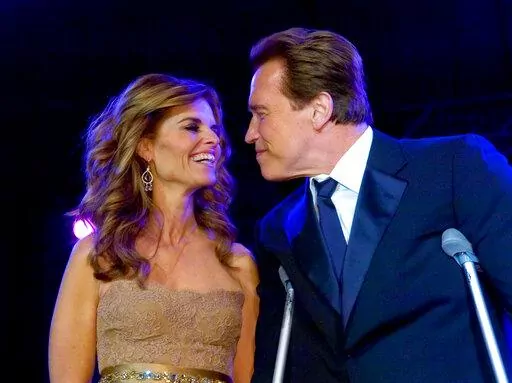 FILE - California first lady Maria Shriver and California Gov. Arnold Schwarzenegger smile together, at the Governor's Inaugural Ball at the Sacramento Convention Center, Friday, Jan. 5, 2007, in Sacramento, Calif. Schwarzenegger and Shriver’s marriage is officially over more than 10 years after the award-winning journalist petitioned to end her then-25-year marriage to the action star and former California governor. A Los Angeles judge finalized the divorce on Tuesday, Dec. 28, 2021, court re
