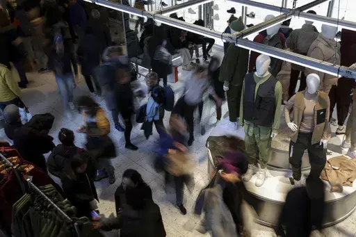 People shop at a retail store on Black Friday, Nov. 25, 2022, in New York. (AP Photo/Julia Nikhinson, File)