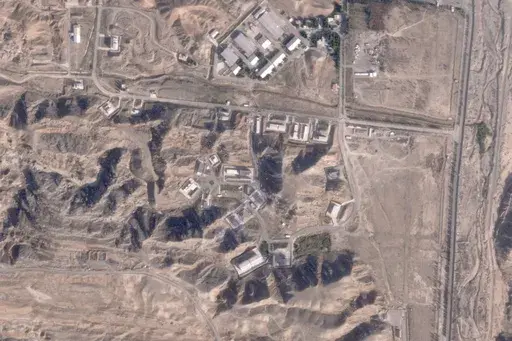 This satellite photo from Planet Labs PBC shows damaged buildings at Iran's Parchin military base outside of Tehran, Iran, Sunday, Oct. 27, 2024. An Israeli attack on Iran damaged facilities at a secretive military base southeast of the Iranian capital that experts in the past have linked to Tehran's onetime nuclear weapons program and at another base tied to its ballistic missile program, satellite photos analyzed Sunday by The Associated Press show. The damaged structures are in the bottom rig
