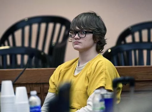 Jesse Osborne waits for a ruling at the Anderson County Courthouse, Feb. 16, 2018, in Anderson, S.C.. Osborne, a school shooter serving a life sentence without parole for killing a first grader on a South Carolina playground when he was 14 is asking a judge to lessen his sentence so he can eventually get out of prison. On Monday, May 22, 2023, Osborne's lawyer asked Judge Lawton McIntosh to reconsider his sentence so Osborne, now 21, could have some hope of freedom in his late 50s or even 60s. (