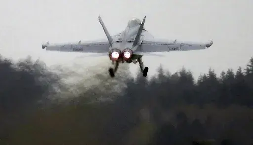 An EA-18G Growler takes off from Naval Air Station Whidbey Island during an exercise, March 10, 2016. (Ken Lambert/The Seattle Times via AP)