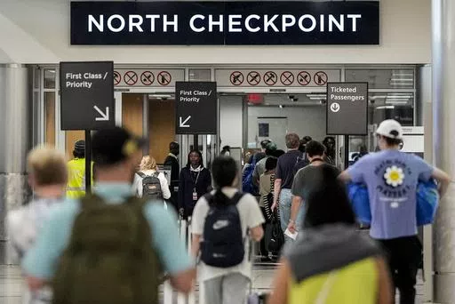 Travelers move through Hartsfield-Jackson Atlanta International Airport ahead of Memorial Day, Friday, May 24, 2024, in Atlanta.(AP Photo/Mike Stewart)