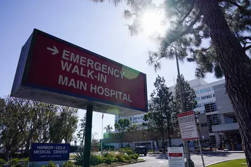 An emergency room sign is displayed outside Harbor-UCLA Medical Center, Feb. 24, 2021, in Torrance, Calif. (AP Photo/Ashley Landis, File)