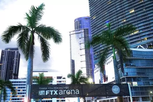 Signage for the FTX Arena, where the Miami Heat basketball team plays, is visible Saturday, Nov. 12, 2022, in Miami. Sam Bankman-Fried received numerous plaudits as he rapidly achieved superstar status as the head of cryptocurrency exchange FTX: the savior of crypto, the newest force in Democratic politics and potentially the world’s first trillionaire. Now the comments about the 30-year-old aren’t so kind after FTX filed for bankruptcy protection Friday, Nov. 11 leaving his investors and cu