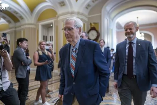 Senate Minority Leader Mitch McConnell, R-Ky., enters the chamber as he returns to work at the Capitol in Washington, Tuesday, Sept. 5, 2023. Questions have mounted over the long-serving Republican leader's health since McConnell froze up last week during a press conference in Kentucky, unable to respond to a question. It was the second such episode in a matter of weeks. (AP Photo/J. Scott Applewhite)