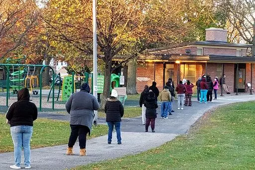 Voters wait in line outside a pavilion at Center Street Park shortly before the polling site opened on Election Day, Nov. 3, 2020, in Milwaukee. An audio recording of a strategy meeting obtained Thursday, Feb. 2, 2023, by The Associated Press shows, that the leaders of then-President Donald Trump's reelection campaign in battleground Wisconsin conceded privately the day after the 2020 election that he had lost, praising Democratic turnout efforts and focusing instead on spreading the lie that De