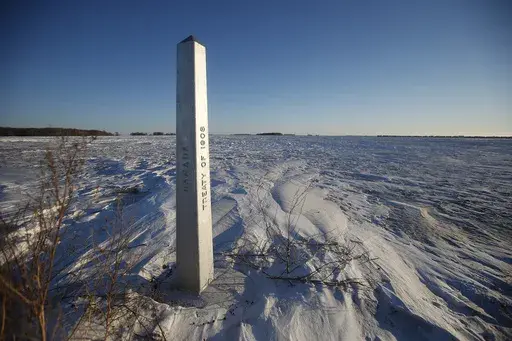 A border marker, between the United States and Canada is shown just outside of Emerson, Manitoba, on Thursday, Jan. 20, 2022. (John Woods/The Canadian Press via AP, File)