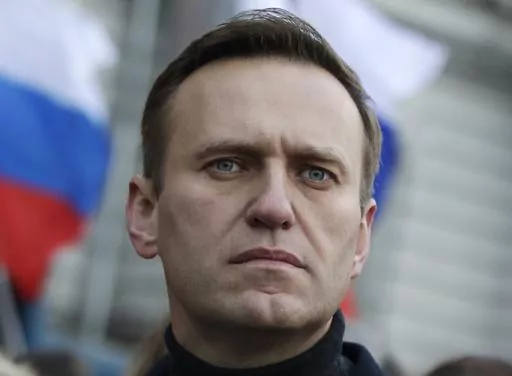 Russian opposition activist Alexei Navalny takes part in a march in memory of opposition leader Boris Nemtsov in Moscow, Russia on Feb. 29, 2020. Associates of imprisoned Russian opposition leader Alexei Navalny say he has been located at a prison colony above the Arctic Circle nearly three weeks after contact with him was lost. Navalny, the most prominent foe of Russian President Vladimir Putin, is serving a 19-year sentence on charges of extremism. (AP Photo/Pavel Golovkin, File)