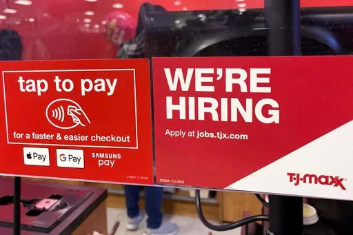 A hiring sign is displayed at a retail store in Mount Prospect, Ill., Friday, Jan. 13, 2023. On Thursday, the Labor Department reports on the number of people who applied for unemployment benefits last week. (AP Photo/Nam Y. Huh, File)