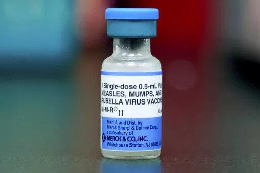 This Friday, May 17, 2019 file photo shows a vial of a measles, mumps and rubella vaccine in Mount Vernon, Ohio. According to a report released by the Centers for Disease Control and Prevention on Thursday, April 21, 2022, a smaller portion of U.S. children got routine vaccinations required for kindergarten during the pandemic, raising concerns that measles and other preventable diseases could increase. (AP Photo/Paul Vernon, File)