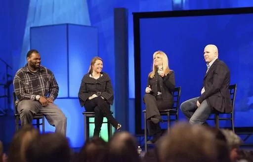 Michael Oher, left, Collins Tuohy, second from left, and Leigh Anne Tuohy, whose lives are portrayed in the Oscar-nominated movie "The Blind Side," speak with Pastor Kerry Shook, right, March 3, 2010 at Woodlands Church's Fellowship Campus in The Woodlands, TX. Michael Oher, the former NFL tackle known for the movie “The Blind Side,” filed a petition Monday, Aug. 14, 2023, in a Tennessee probate court accusing Sean and Leigh Anne Tuohy of lying to him by having him sign papers making them hi