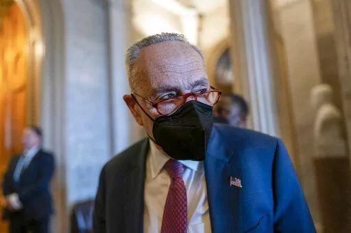 Senate Majority Leader Chuck Schumer, D-N.Y., tells reporters that the Senate will get the work done to fund the government before the Friday midnight deadline, at the Capitol in Washington, Thursday, Feb. 17, 2022. (AP Photo/J. Scott Applewhite)