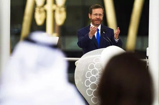 Israeli President Isaac Herzog speaks at Expo 2020 in Dubai, United Arab Emirates, Monday, Jan. 31, 2022. The UAE intercepted a ballistic missile fired by Yemen's Houthi rebels early Monday as the Israeli president visited the country, authorities said, the third such attack in recent weeks. (AP Photo/Jon Gambrell)