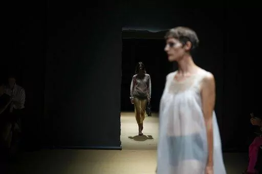 A model wears a creation as part of the Prada women's Spring Summer 2023 collection presented in Milan, Italy, Thursday, Sept. 22, 2022. (AP Photo/Antonio Calanni)