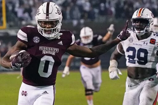 Then-Mississippi State wide receiver Rara Thomas (0) smiles after catching a pass for a touchdown against Auburn during the second half of an NCAA college football game in Starkville, Miss., Saturday, Nov. 5, 2022. Rodarius “Rara” Thomas, a wide receiver who recently transferred to Georgia from Mississippi State, was jailed early Monday, Jan. 23, 2023, in Athens, Ga., on a felony charge of false imprisonment and a misdemeanor count of family violence battery, according to Clarke County jail 