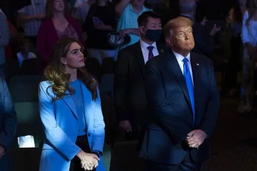President Donald Trump attends church at International Church of Las Vegas with counselor Hope Hicks, left, Sunday, Oct. 18, 2020, in Las Vegas, Nev. Hicks, Trump's former spokeswoman, met Monday, March 6, 2023, with Manhattan prosecutors investigating hush-money payments made on the ex-president's behalf — the latest member of the Republican's inner circle to be questioned in the renewed probe. (AP Photo/Alex Brandon, File)