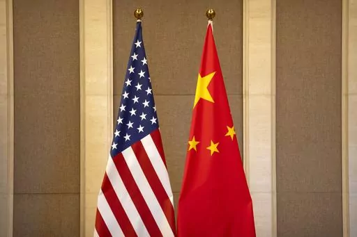 United States and Chinese flags are set up before a meeting between Treasury Secretary Janet Yellen and Chinese Vice Premier He Lifeng at the Diaoyutai State Guesthouse in Beijing, on July 8, 2023. China said the United States is the "biggest disruptor of regional peace and stability" in the world in a scathing response Wednesday, Oct. 25, 2023 to a Pentagon report on China's growing military buildup. (AP Photo/Mark Schiefelbein, Pool, File)