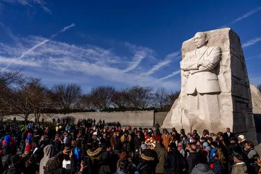 A large group gathers to watch a wreath-laying ceremony at the Martin Luther King Jr. Memorial on Martin Luther King Jr. Day in Washington, Monday, Jan. 16, 2023. (AP Photo/Andrew Harnik)