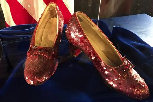 Ruby slippers once worn by Judy Garland in the "The Wizard of Oz" are displayed at a news conference on Sept. 4, 2018, at the FBI office in Brooklyn Center, Minn. Terry Jon Martin, the aging reformed mobster who has admitted stealing the slippers, gave into the temptation of “one last score” after an old mob associate led him to believe the famous shoes must be adorned with real jewels to justify their $1 million insured value according to a new memo filed ahead of his Monday, Jan. 29, 2024,