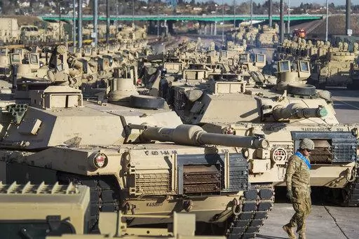 A soldier walks past a line of M1 Abrams tanks, Nov. 29, 2016, at Fort Carson in Colorado Springs, Colo. In what would be a reversal, the Biden administration is poised to approve sending M1 Abrams tanks to Ukraine, U.S. officials said Tuesday, as international reluctance toward sending tanks to the battlefront against the Russians begins to erode. The decision could be announced as soon as Wednesday though it could take months or years for the tanks to be delivered. (Christian Murdock/The Gazet