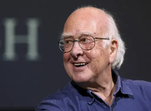 Britain's Professor Peter Higgs smiles during a press conference in Edinburgh, Scotland, on Oct. 11, 2013. The University of Edinburgh says Nobel prize-winning physicist Peter Higgs, who proposed the existence of the Higgs boson particle, has died at 94. Higgs predicted the existence of a new particle — the so-called Higgs boson — in 1964. But it would be almost 50 years before the particle’s existence could be confirmed at the Large Hadron Collider. Higgs won the 2013 Nobel Prize in Physi