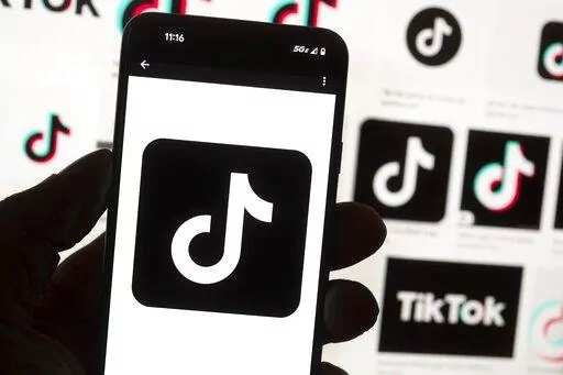 The TikTok logo is seen on a cell phone on Oct. 14, 2022, in Boston. On Thursday, Jan. 12, 2023, Wisconsin became the latest state to ban the use of TikTok on state phones and other devices, a move that comes amid a push for a federal ban and after nearly half of the states nationwide have blocked the popular app. (AP Photo/Michael Dwyer, File)