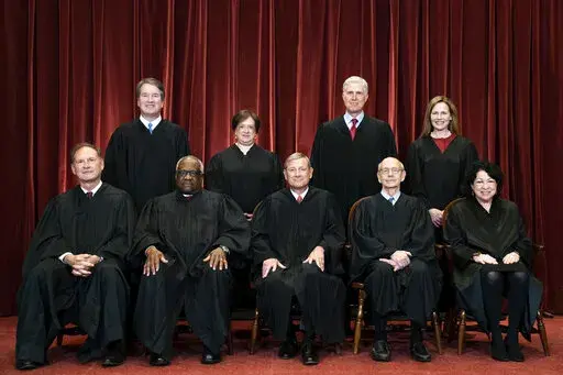 Members of the Supreme Court pose for a group photo at the Supreme Court in Washington, April 23, 2021. Seated from left are Associate Justice Samuel Alito, Associate Justice Clarence Thomas, Chief Justice John Roberts, Associate Justice Stephen Breyer and Associate Justice Sonia Sotomayor, Standing from left are Associate Justice Brett Kavanaugh, Associate Justice Elena Kagan, Associate Justice Neil Gorsuch and Associate Justice Amy Coney Barrett. (Erin Schaff/The New York Times via AP, Pool, F