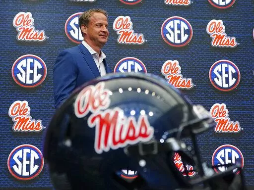 Mississippi head coach Lane Kiffin walks to the podium before speaking during NCAA college football Southeastern Conference Media Day on July 18, 2022, in Atlanta. Kiffin has picked up two dozen players from the transfer portal, including quarterback contender Jaxson Dart from USC. It was the No. 2-rated transfer class, according to 247Sports. (AP Photo/John Bazemore, File)