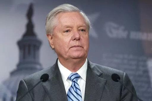 Sen. Lindsey Graham, R-S.C., speaks with reporters about aid to Ukraine, on Capitol Hill, Wednesday, March 10, 2022, in Washington. Attorneys representing Graham said Wednesday, July 6, that he intends to challenge a subpoena compelling him to testify before a special grand jury in Georgia investigating former President Donald Trump and his allies' actions after the 2020 election. (AP Photo/Alex Brandon, File)