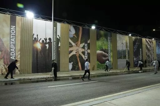 Workers clean a sewage leak at the COP27 U.N. Climate Summit, Wednesday, Nov. 9, 2022, in Sharm el-Sheikh, Egypt. (AP Photo/Nariman El-Mofty)